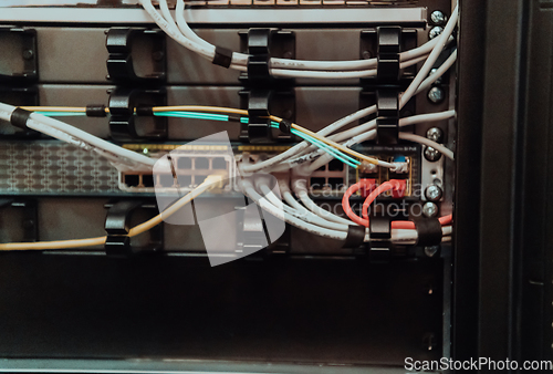 Image of Close up of technician setting up network in server room