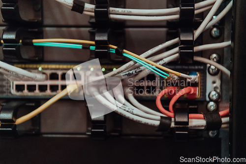 Image of Close up of technician setting up network in server room