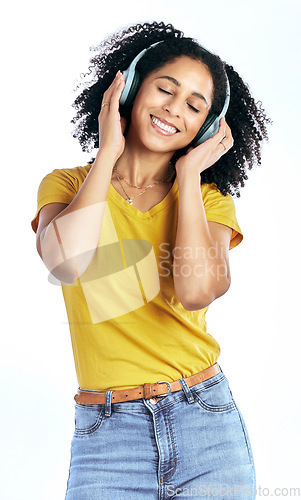 Image of Music, happy and a woman with headphones in studio streaming audio, sound or radio. Peace, smile and a young African person isolated on a white background listening to fun song to relax or meditate