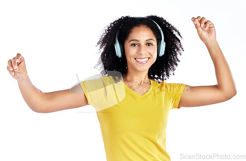 Image of Dance, music and portrait of a woman with headphones in studio streaming audio, sound or radio. Energy, happy and African person isolated on a white background listening and moving to fun song