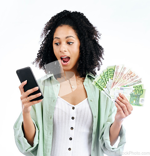 Image of Woman, phone and money with surprise in studio for prize, investment and excited by white background. Isolated African girl, smartphone and winner with cash fan, giveaway or profit with fintech app
