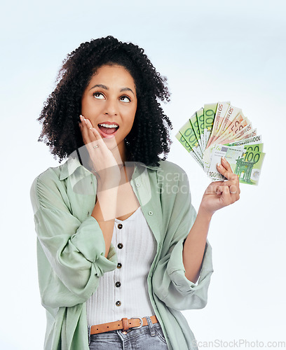 Image of Woman, cash fan and thinking in studio for prize, profit or bonus from investing, savings or wow by white background. Isolated African girl, student and surprise for money, win and gambling in lotto
