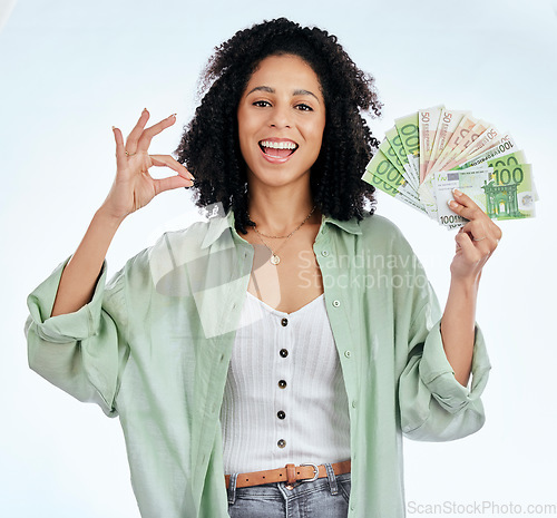 Image of Woman, ok sign and money in studio portrait for prize, profit or win with investing, savings or notes by white background. Isolated African girl, excited student and cash with icon, gambling or lotto