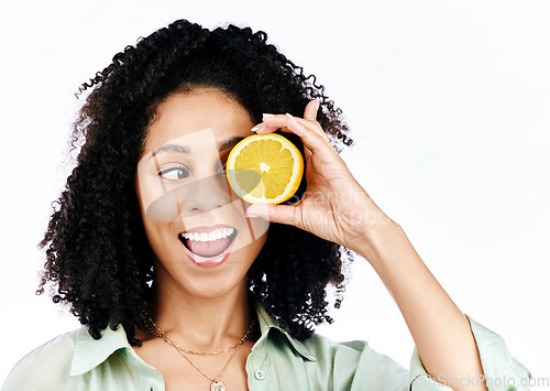 Image of Citrus, lemon and eye of woman with fashion for organic wellness isolated in a studio white background. Diet, fruit and happy or excited young person with crazy vitamin c energy, health and detox