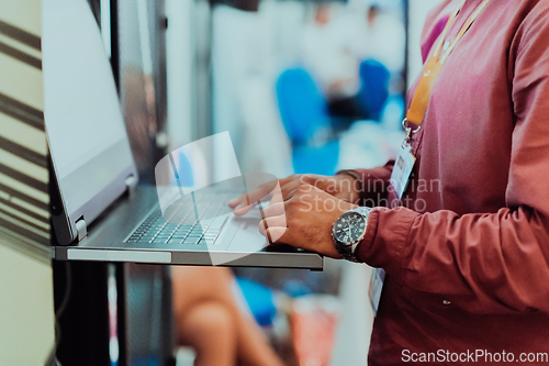 Image of Close up of business hands are typing on laptop.