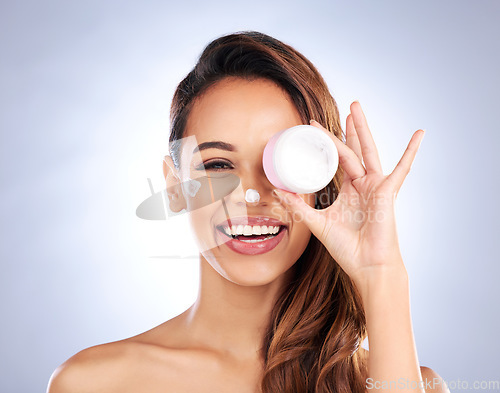 Image of Portrait, cream jar and beauty of woman in studio with cosmetics product on grey background. Happy female model, face lotion and skincare container for sunscreen, aesthetic dermatology or moisturizer