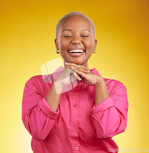 Image of Happy, cute and black woman laughing in studio to funny, joke or silly memory on yellow background. Laughing, smile and African female remember, humor or goofy moment, good mood or positive attitude