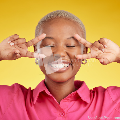 Image of Peace, hands and black woman happy in studio with thank you, vote or positive mindset on yellow background. V, sign and African female with good vibes, smile and freedom emoji, support or self love