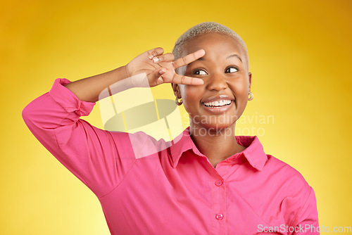 Image of Peace, hands and happy black woman in studio with thank you, vote or positive feedback on yellow background. V, sign and African female with good vibes, smile and freedom emoji, support or self love