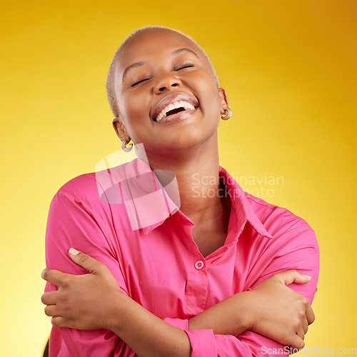 Image of Smile, hug and black woman in studio with self love, acceptance and positive mindset on yellow background. Happy, embrace and African female with freedom, authentic and real with body positivity