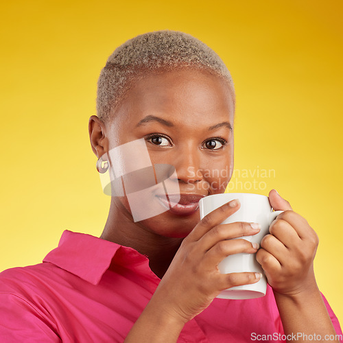 Image of Smile, portrait and black woman relax with coffee in studio, calm and peaceful on yellow background. Tea, drinking and face of African female chilling with comfort beverage, happy and enjoy me time