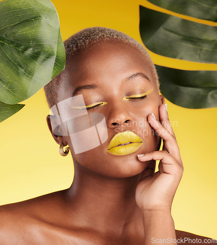 Image of Calm black woman, makeup and natural beauty in relax for cosmetics with leafs against a yellow studio background. Face of African female person with eyes closed in satisfaction for facial treatment
