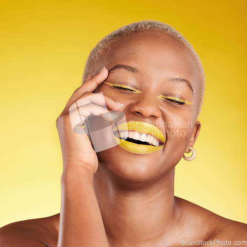 Image of Happy black woman, makeup and cosmetics for skincare, art or fashion against a yellow background. Face of African female person smile in satisfaction for lipstick, beauty product or facial treatment