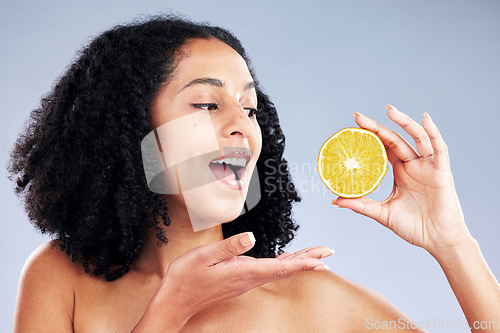 Image of Skincare, excited and woman with lemon in studio isolated on a white background. African model, natural food and fruit for nutrition, vitamin c and healthy diet for beauty benefits, wellness or vegan