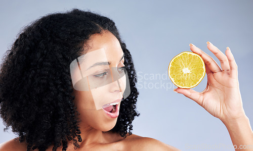 Image of Woman, lemon and thinking for skincare, studio and wow for natural results for health by background. Girl, African model and fruit for cosmetics, self care and surprise with idea, aesthetic and glow