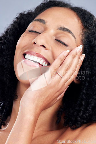 Image of Face, skincare and happy woman touch for beauty in studio isolated on a white background. Natural, cosmetics and African model smile with spa facial treatment for aesthetic, wellness and healthy skin