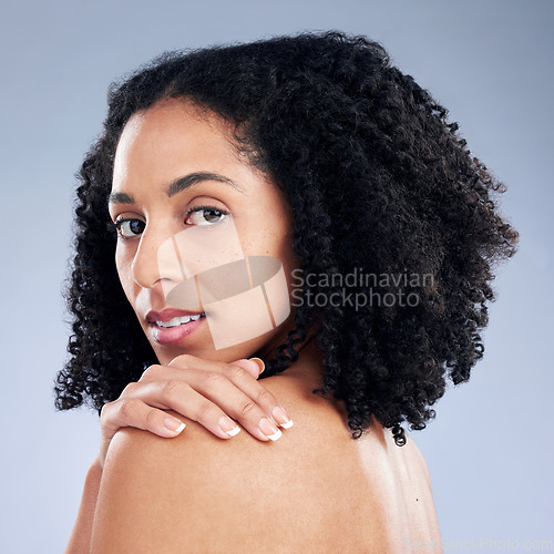 Image of Skin, beauty and a woman with hand on shoulder for dermatology, cosmetics and natural makeup. Portrait of African female model on a studio background for self care, glow and soft touch with manicure