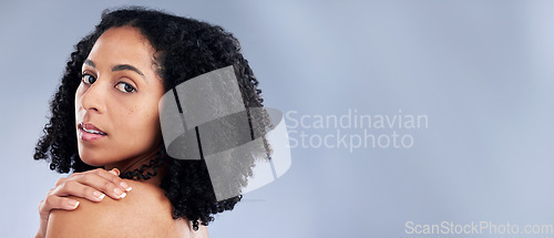 Image of Portrait, beauty and mockup with an african woman in studio on gray background for skincare. Face, space and confident with a young female model advertising or marketing luxury wellness or treatment