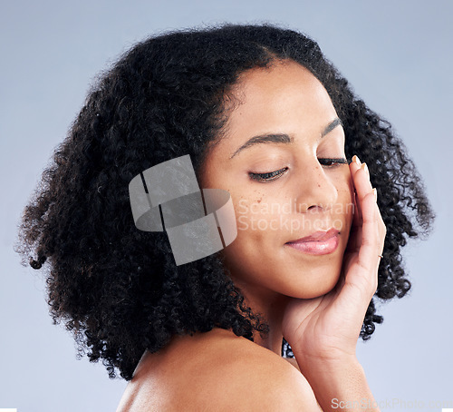 Image of Face, skincare touch and woman with beauty in studio isolated on a white background. Natural, cosmetic and African model with spa facial treatment for aesthetic, wellness or health for dermatology