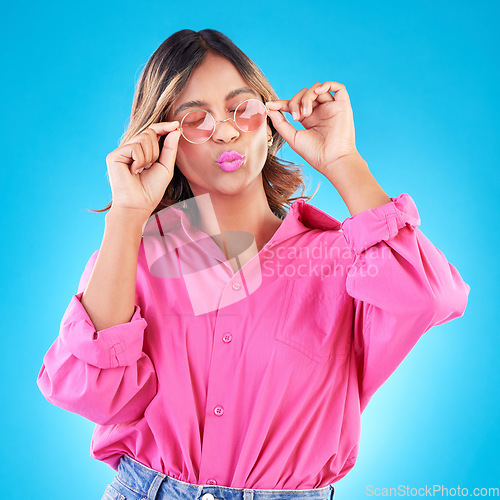 Image of Fashion sunglasses, makeup and woman in studio isolated on a blue background. Cosmetics, glasses and Indian model with lipstick, style and casual summer clothes for aesthetic, gen z and eyes closed