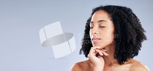 Image of Face, beauty and mockup with a woman eyes closed in studio on a gray background for skincare. Facial, skin and space with a young female model advertising or marketing natural and luxury wellness