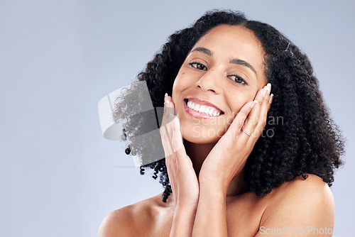 Image of Beauty, skin and a woman with hands on face for dermatology, cosmetics and natural makeup. Portrait of a happy african female model on a studio background for facial self care, glow and soft touch