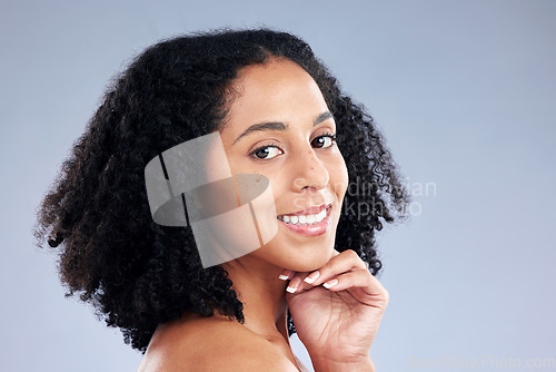 Image of Portrait, beauty and smile with a model woman in studio on a gray background for skincare. Face, aesthetic and happy with a young African female person at the salon for natural wellness or treatment