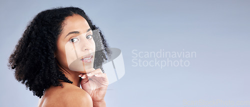 Image of Portrait, skincare and space with a model black woman in studio on a gray background for beauty. Face, aesthetic and mockup with a young female person at the salon for luxury wellness marketing