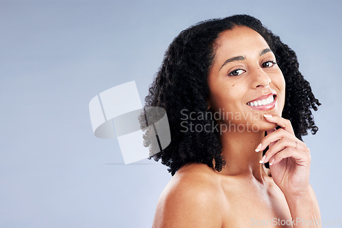 Image of Smile, beauty and portrait of a woman with skin care, dermatology and cosmetics or natural makeup. Headshot of a happy african female model on a studio background for facial glow and mockup space