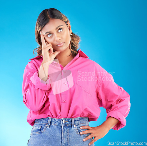 Image of Thinking, tired and stress with face of woman in studio for doubt, confused and brain fog. Mental health, burnout and anxiety with person on blue background for frustrated, idea and problem mockup