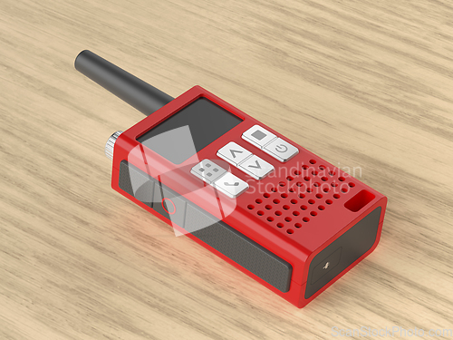 Image of Walkie talkie on wooden desk
