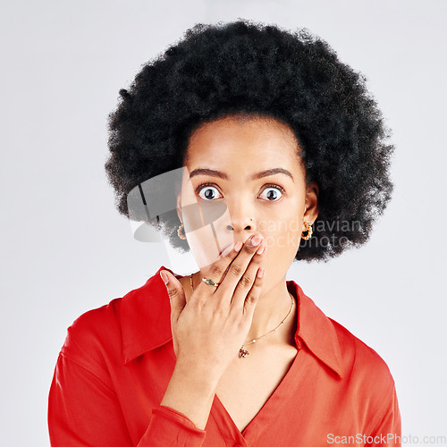 Image of Surprise, gossip or portrait of black woman cover mouth for secret isolated on white background in studio. Hands on face, wow or shocked girl surprised by crazy announcement, drama story or fake news
