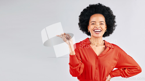 Image of Portrait, pointing and black woman mockup, smile and promotion against a white studio background. Face, female person and model with hand gesture, showing and choice with presentation and opportunity