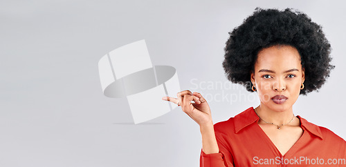 Image of Serious face, pointing and black woman mockup, opportunity and presenting against a white studio background. Portrait, female person and model with hand gesture, showing and choice with discount deal