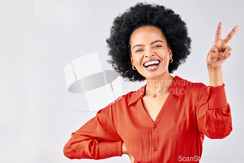 Image of Crazy, peace sign and portrait of a black woman on a studio background with an emoji. Smile, funny model and an African girl or employee with a hand gesture isolated on a backdrop for comedy