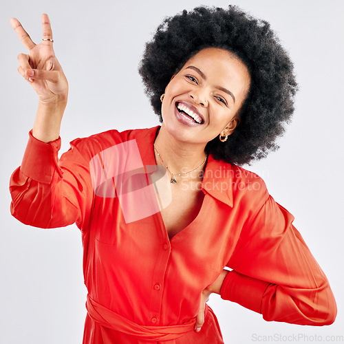 Image of Support, peace sign and portrait of a black woman on a studio background with an emoji. Smile, funny model and an African girl or employee with a hand gesture isolated on a backdrop for comedy