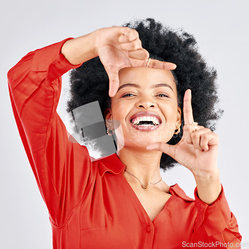 Image of Portrait, happy black woman and finger frame in studio to review profile picture on white background. Face of female model planning perspective for photography, creative inspiration and hand sign