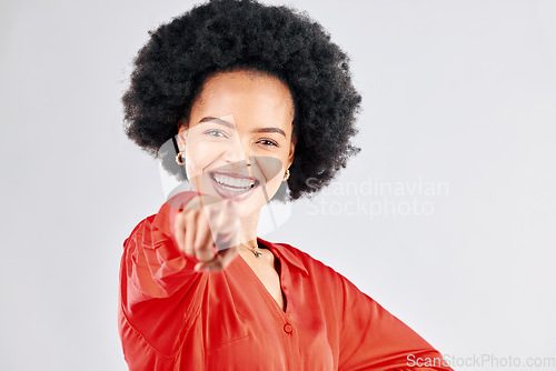 Image of Portrait, smile and pointing with an afro black woman in studio on a white background to vote for you. Face, opportunity and voice with a happy young female making a choice, selection or decision