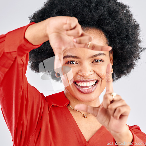 Image of Portrait, finger frame or face of black woman in studio to review profile picture on white background. Happy female model, hands or planning perspective of photography, selfie or creative inspiration