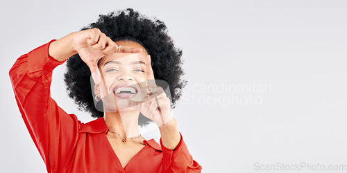 Image of Happy, portrait and black woman with hand frame for a selfie, picture or capture on a studio background. Smile, mockup and an African girl with a gesture for a photo isolated on a backdrop with space