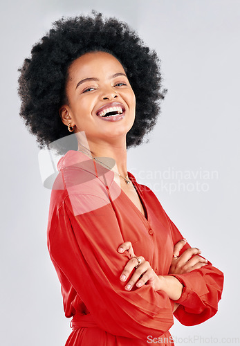Image of Portrait, fashion and arms crossed with an afro black woman in studio on a white background for trendy style. Smile, confident and red with a happy young female model posing in a clothes outfit