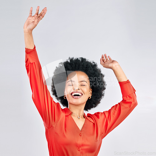 Image of Happy black woman, afro and dancing in celebration for discount, sale or fashion against a white studio background. Excited African female person in happiness for winning, achievement or bonus promo