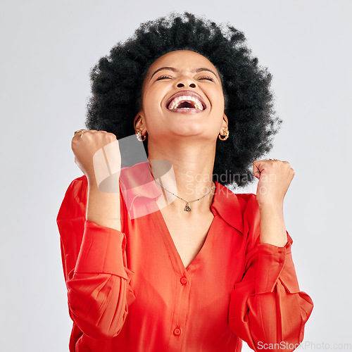 Image of Happy black woman, winner and fist in studio for celebration, achievement and success on white background. Face of excited model celebrate winning prize, deal and victory of lottery, bonus and reward