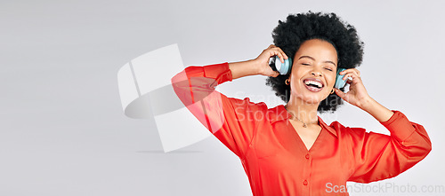 Image of Black woman, music and headphones in mockup studio for podcast, subscription and banner space on white background. Face, freedom and happy model streaming radio, listening to sound and hearing audio