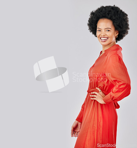 Image of Portrait, fashion and space with an afro black woman in studio on a white background for trendy style. Mockup, smile and red clothes with a happy young female model posing in a clothing outfit