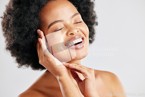 Image of Beauty, skin care and a happy black woman with dermatology, cosmetics or natural makeup. Face of African female model in studio for facial glow, self love and soft touch on a white background