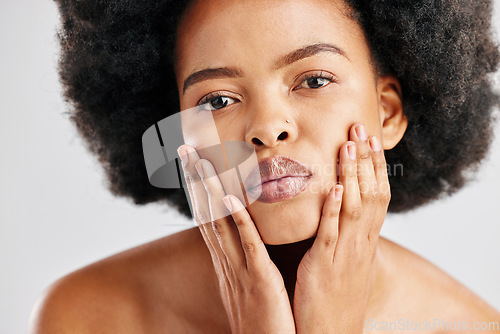 Image of Portrait, black woman and touch face for skincare, aesthetic glow and soft dermatology on white background. Female model, natural beauty and afro hair in studio for shine, healthy facial or self care