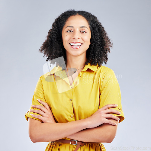 Image of Happy, arms crossed and portrait of business woman in studio for professional, creative and designer. Pride, startup and smile with employee on white background for career, entrepreneur and mockup