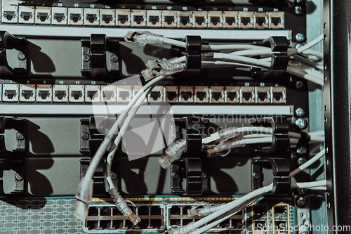 Image of Close up of technician setting up network in server room