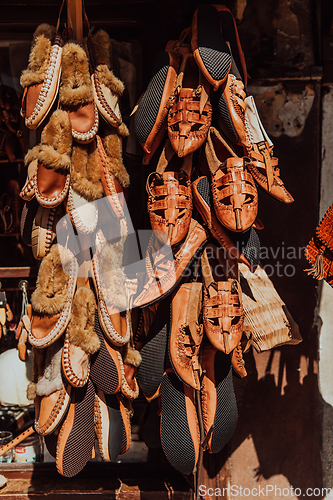 Image of Macedonian folklore, brown sandals. Old shoes. Part of the tradition. Black pants, close up